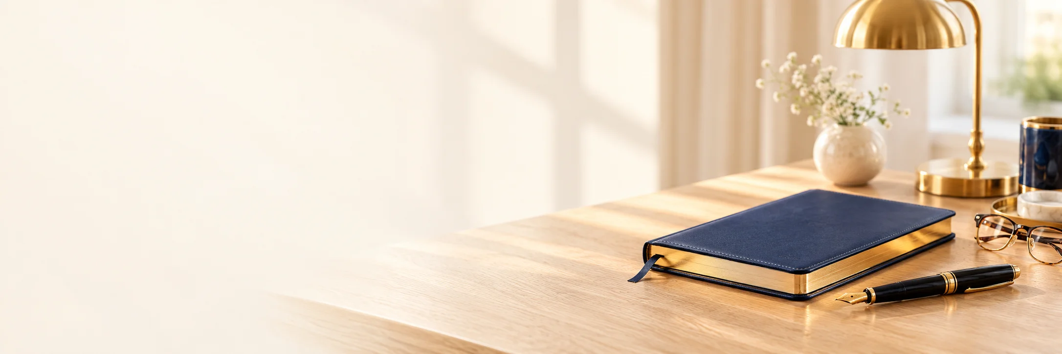 A study desk with books and a desk lamp